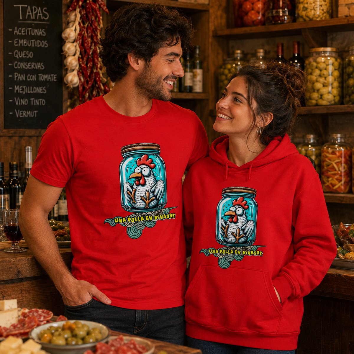 Pareja con camiseta y sudadera rojas Una Polla en Vinagre, humor español